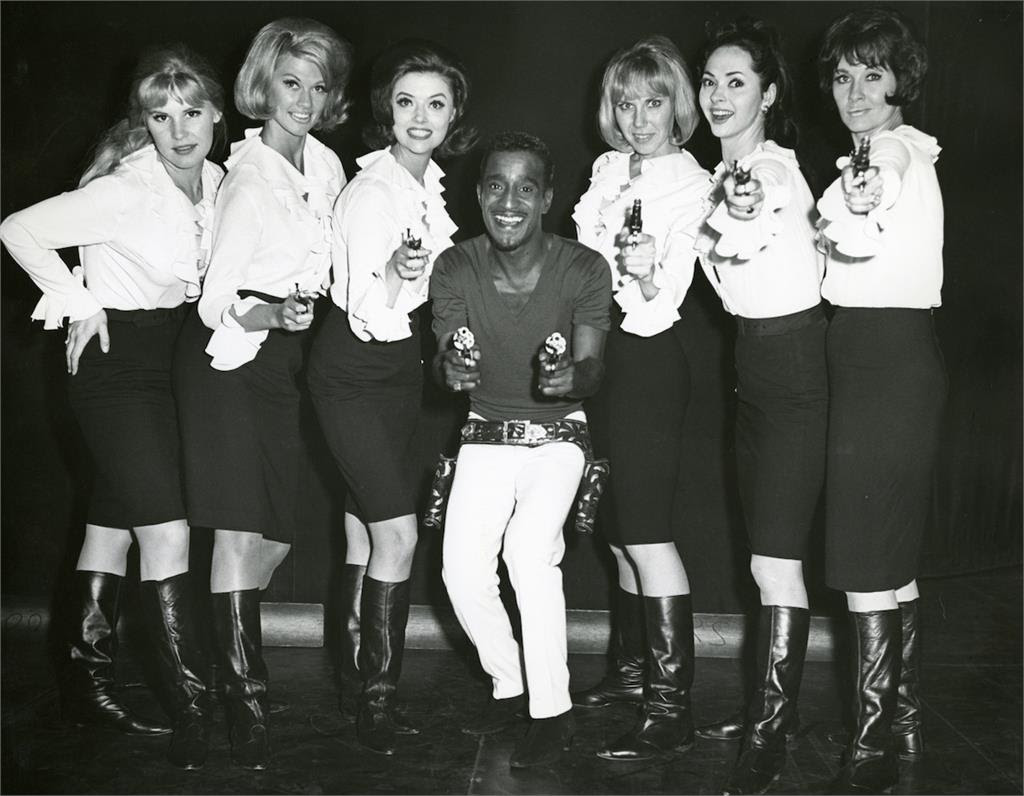 Sammy Davis, Jr. takes aim in a backstage photo with his dancers in a scene from the documentary SAMMY DAVIS, JR.: I’VE GOTTA BE ME. Photo Credit: The Estate of Altovise Davis