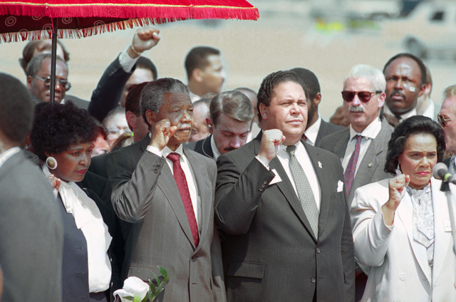 Maynard Documentary. Atlanta. Mayor Maynard Jackson (C) and Coretta Scott king, widow of slain civil rights leader Dr. Martin Luther King, Jr., join Nelson Mandela in holding up clenched fists during the playing of the Anthem of Mandela's African National Congress upon Mandela's arrival.