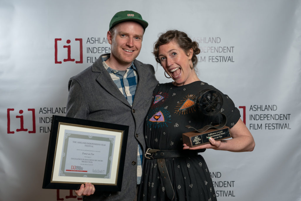 Filmmakers Reed Harkness and Heather Hawksford receive the audience award for Best Documentary Short and special jury recognition for Documentary Short Production for their film Forest on Fire. Photo by Kyle Asher, courtesy of the Ashland Independent Film Festival