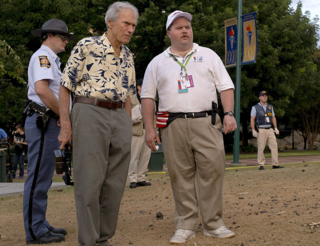 (L-R) CLINT EASTWOOD and PAUL WALTER HAUSER on the set of Warner Bros. Pictures’ “RICHARD JEWELL,” a Warner Bros. Pictures release. Photo by Claire Folger