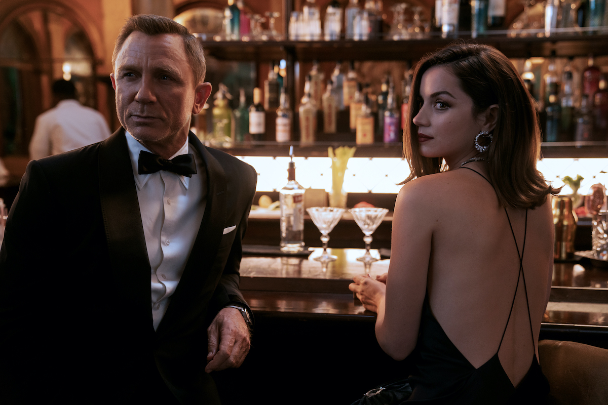 James Bond (Daniel Craig) and Paloma (Ana de Armas) in NO TIME TO DIE